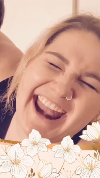 Girl looking extra happy with flower border at bottom